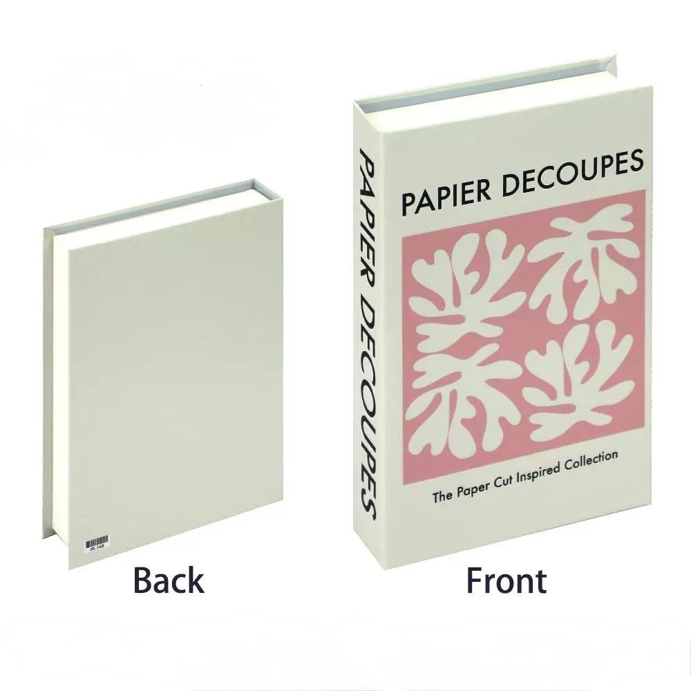 Bright pastel “Capri Bliss” book placed diagonally atop a soft stack of decor books.