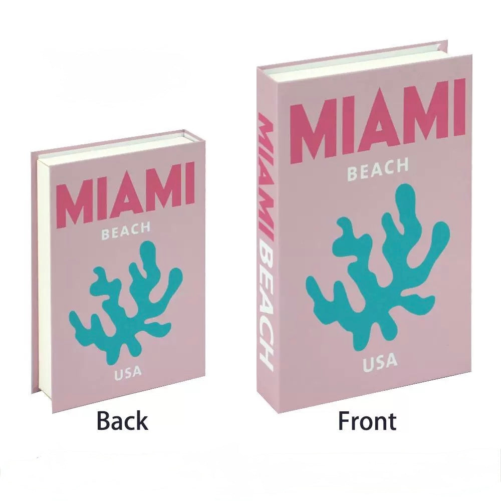 Capri Bliss book placed on top of pastel Barcelona and Miami Beach boxes in a stylish corner.