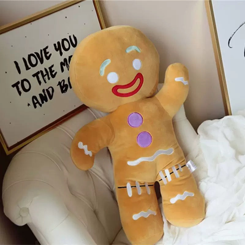 Soft gingerbread man plush toy for holiday decor.