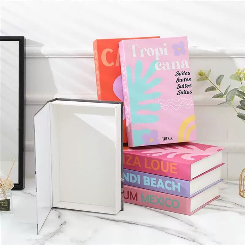 Faux books styled with fresh tulips for vibrant, cozy dorm decor.