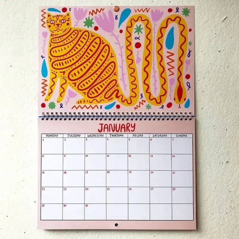 Adorable 2025 wall calendar with illustrated cats