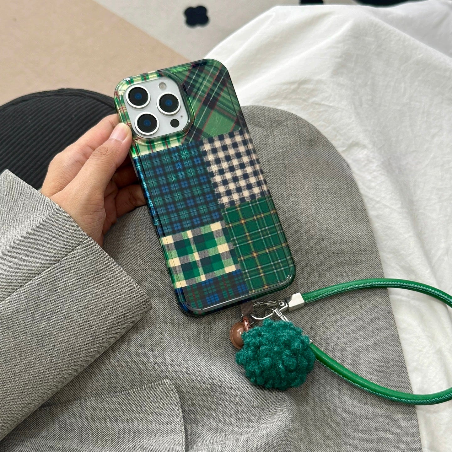 Plaid phone case styled with houndstooth aesthetic