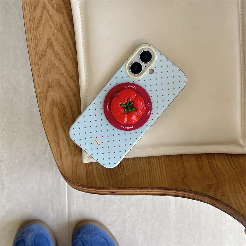 Phone case with tomato design on a wooden table