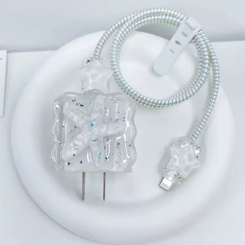 Clear electronic component with metallic parts on a white background