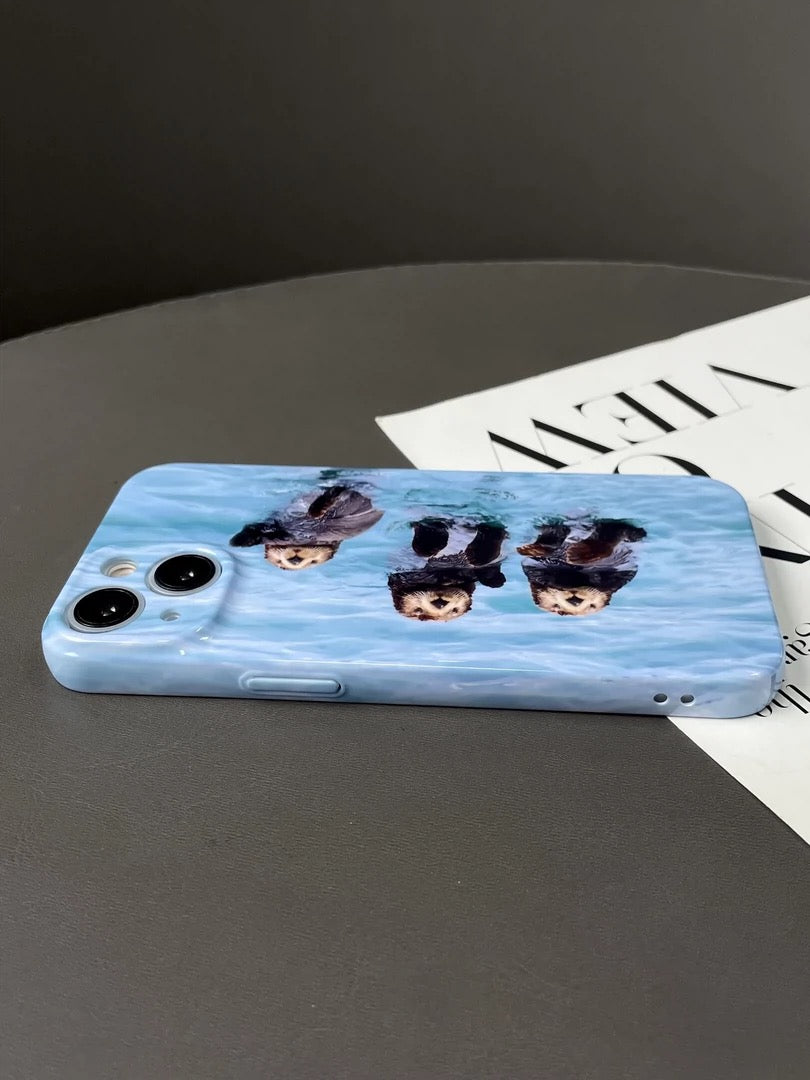 iPhone case with adorable otter design in blue