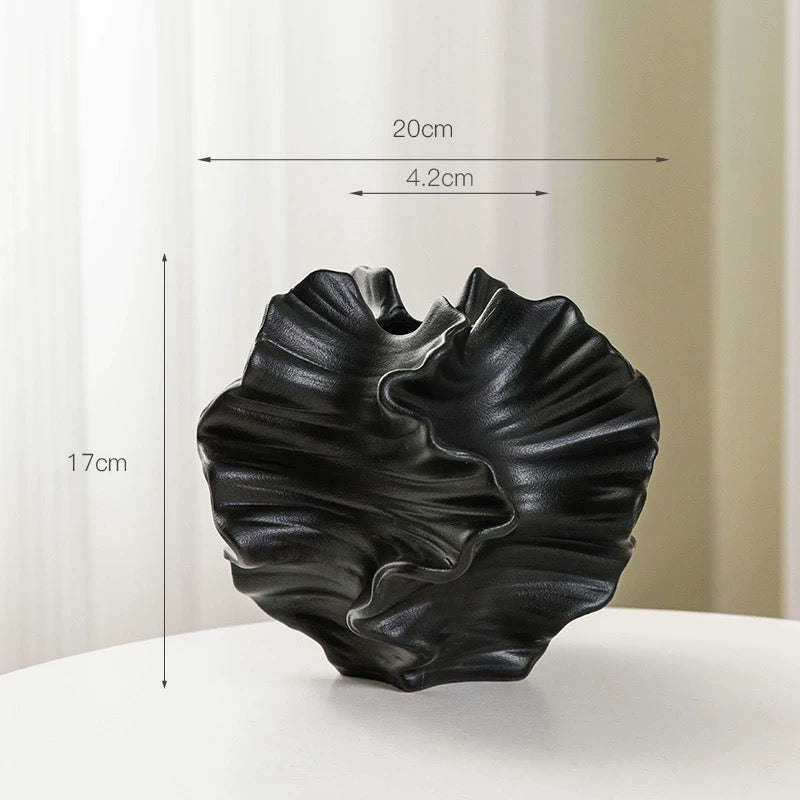 Black ceramic vase with dimensions indicated on a white background