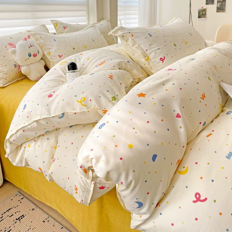 Layered pillows in pastel prints creating a cozy Pinterest look