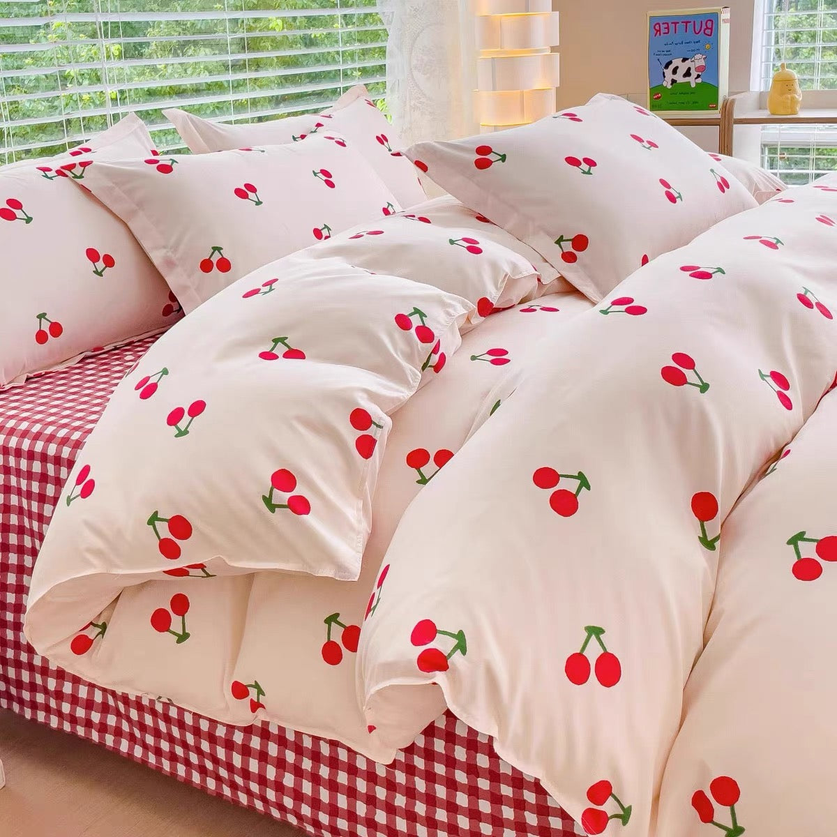 Cute cherry print bedding with gingham flat sheet and matching pillowcases.