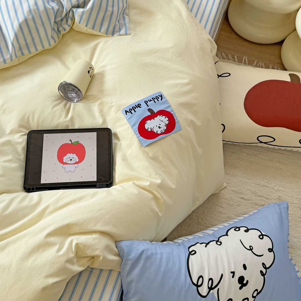 Minimalist dorm bed styled with kawaii dog pillow and striped sheets