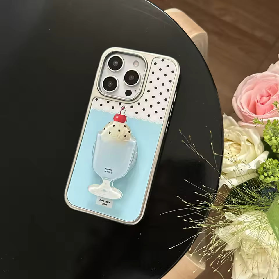Phone case with ice cream design on a black surface with flowers