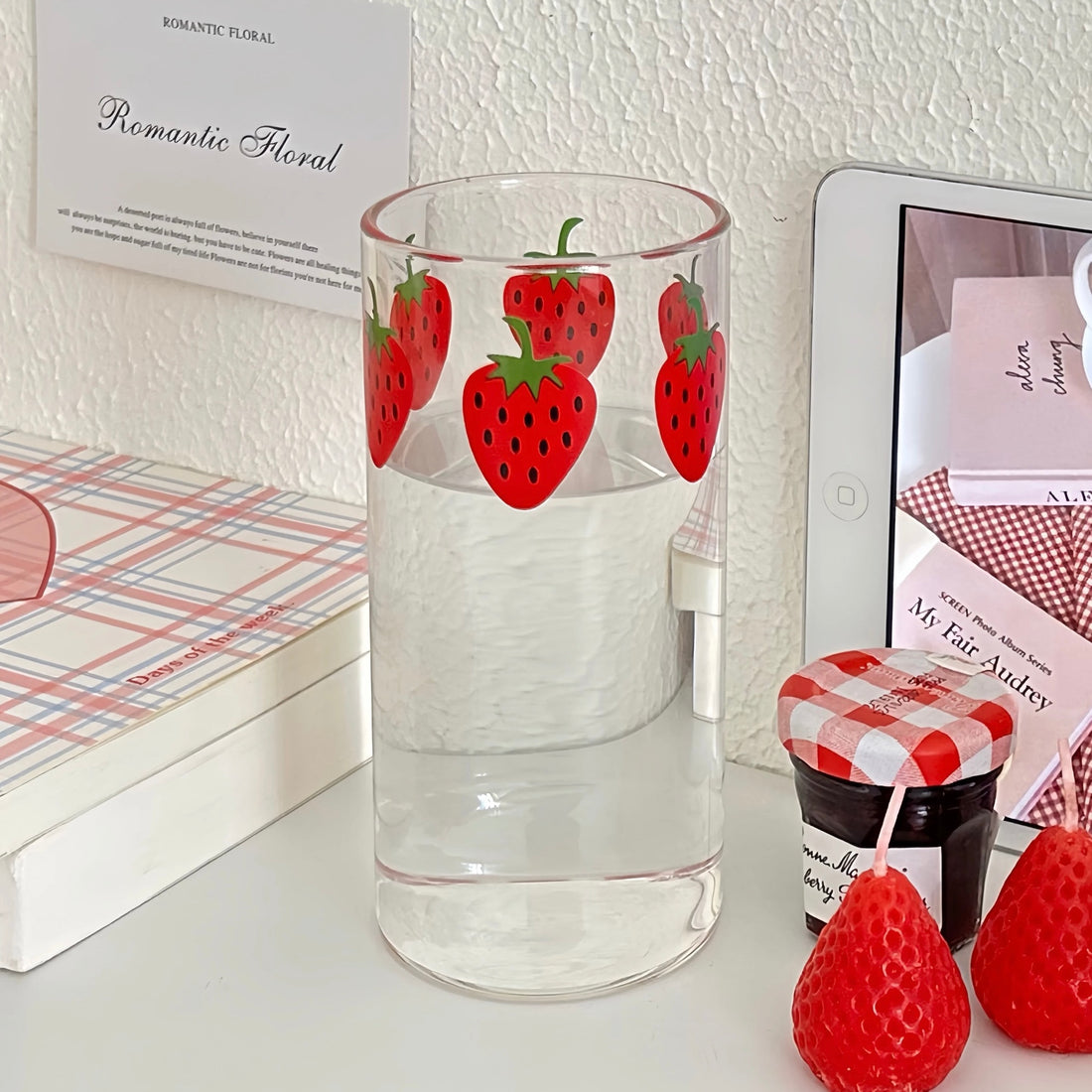 Strawberry glass cup with iced coffee inside