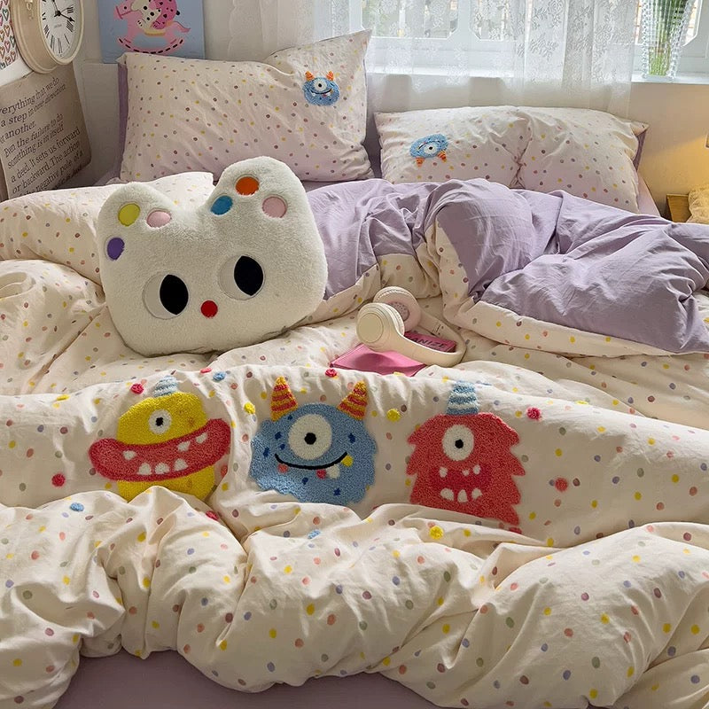 Cartoon embroidery detail on washed cotton fabric for dopamine decor bedding.