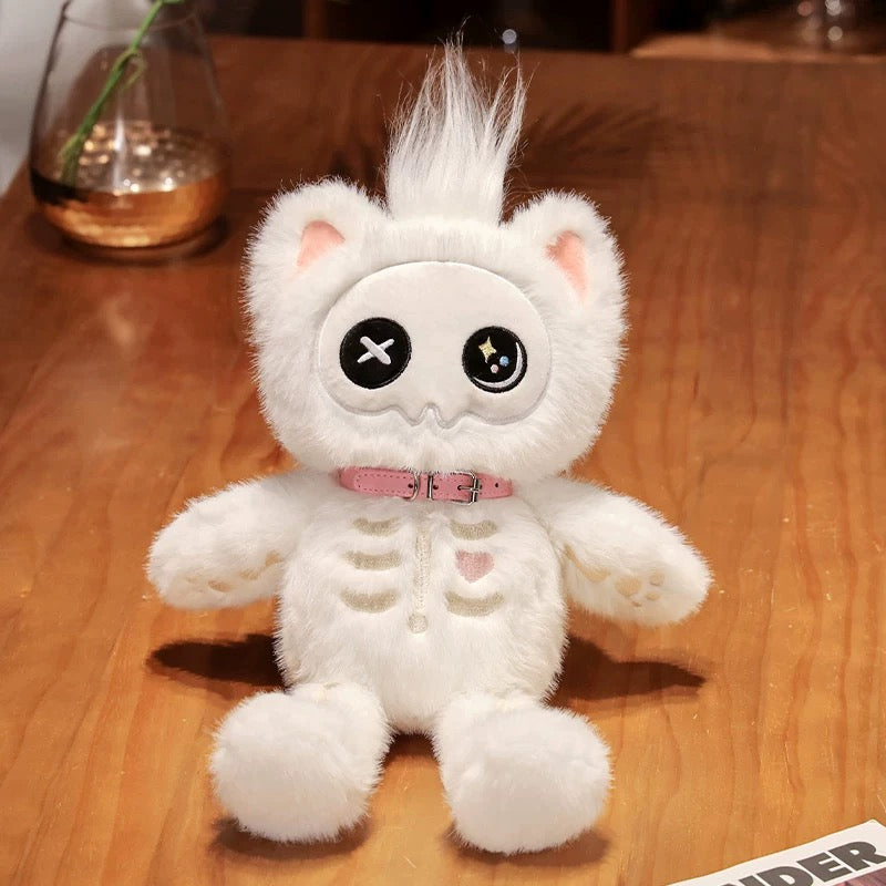 White plush toy with black eyes and a pink collar on a wooden surface