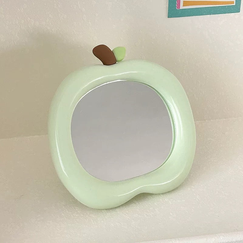 Decorative apple mirror for girls with aesthetic pastel background