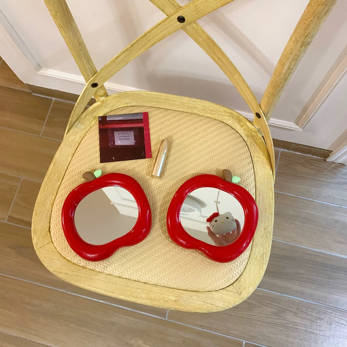 Aesthetic apple mirror surrounded by pastel home accessories