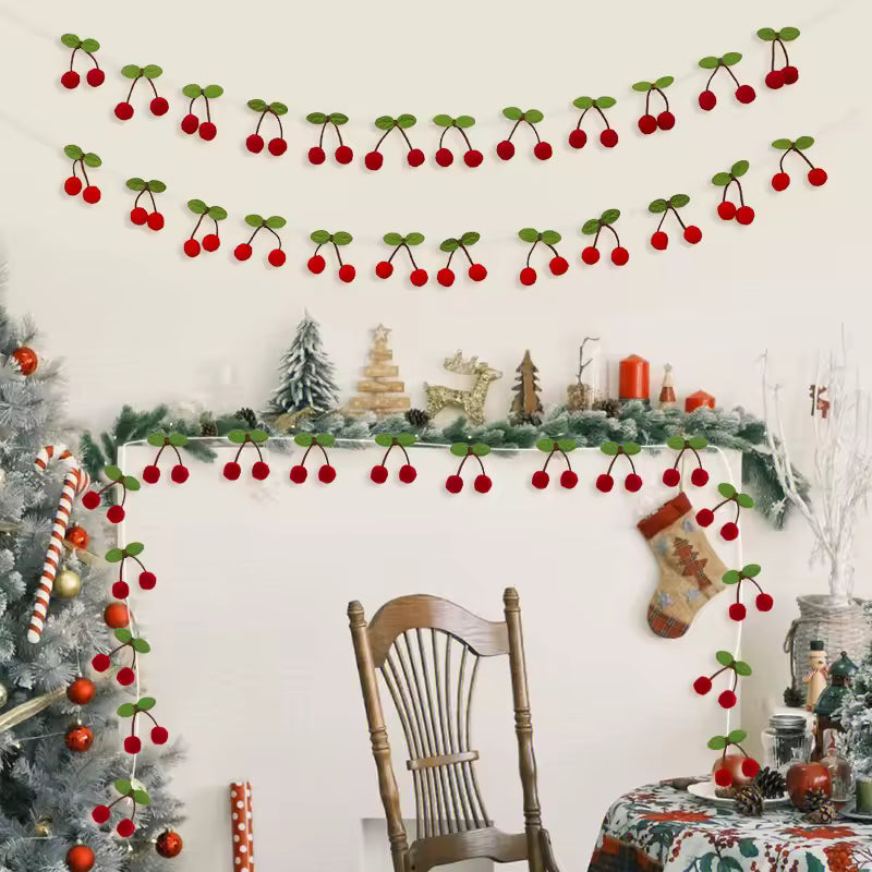 Decorative Christmas garland with red berries and green leaves on a wall above a fireplace.