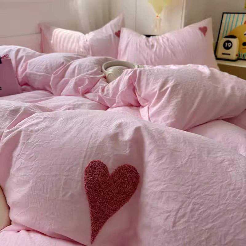 4-piece bedding set including duvet, sheet, and pillowcases in blush pink