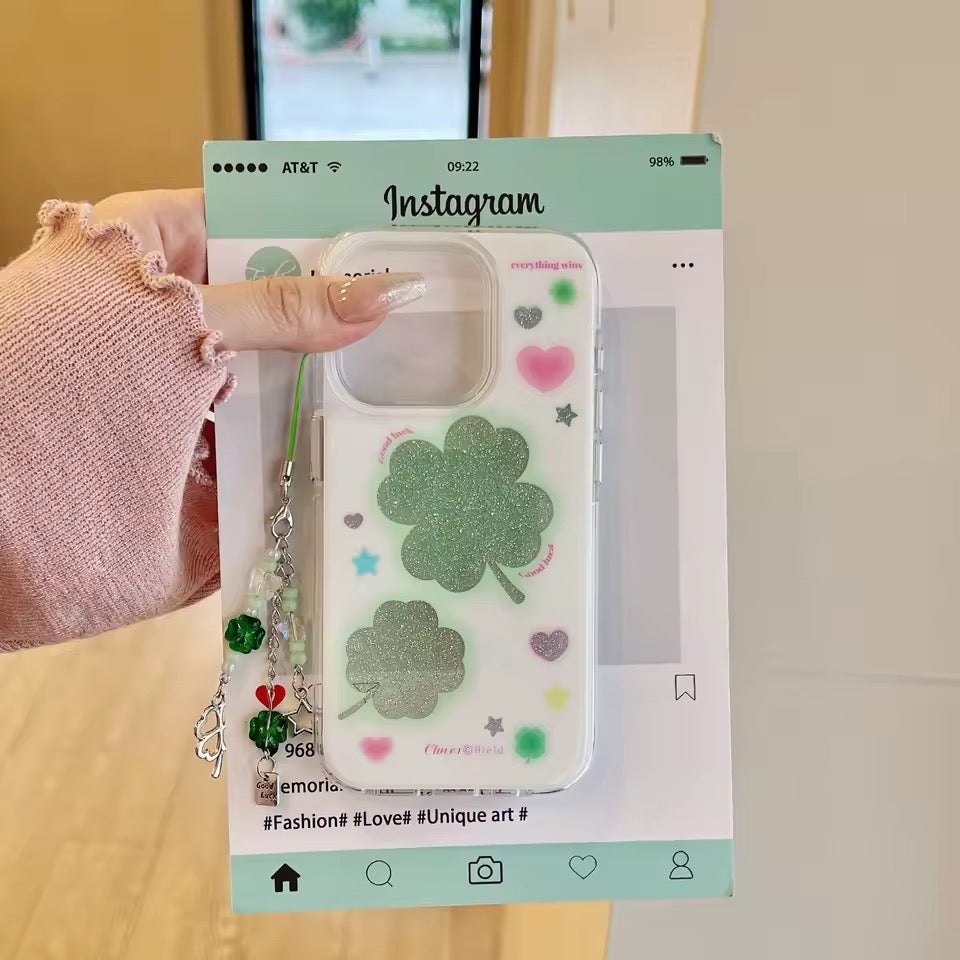 Phone case with clover design held by a hand, displayed on an Instagram-themed card.