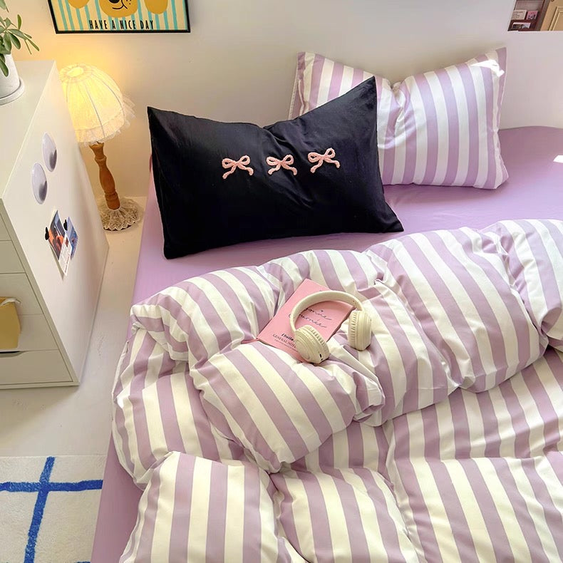 Teen girl's dorm room transformed with the soft girl aesthetic purple striped bedding set