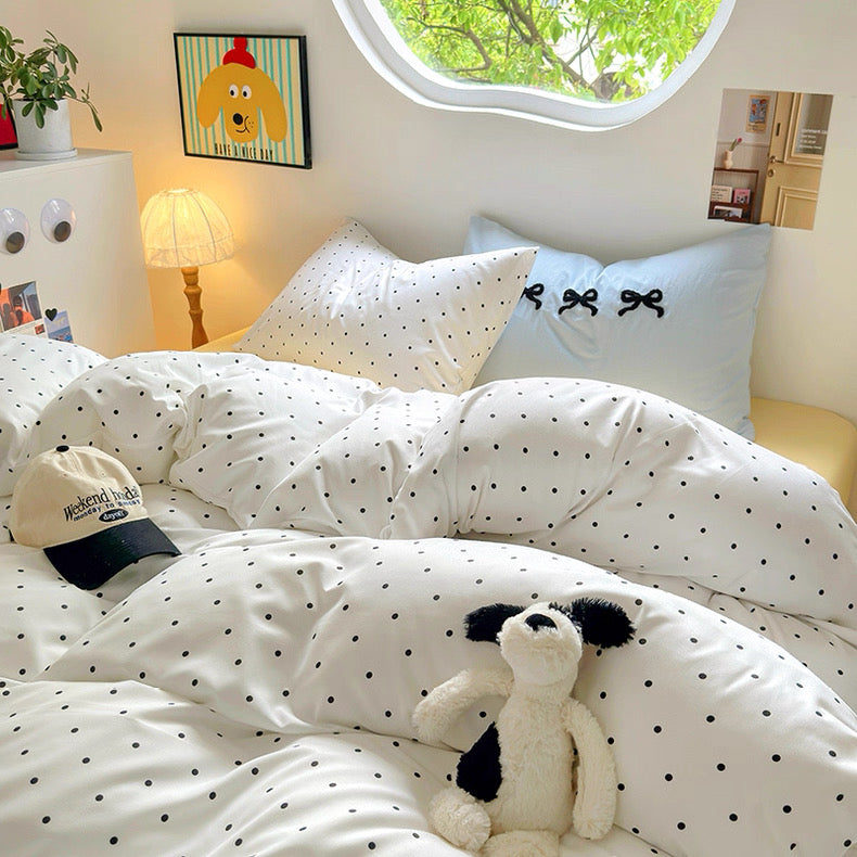 Korean minimalist bed decor with crisp polka dot comforter and blue pillows