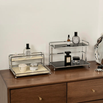 Two glass shelves with decorative items on a wooden surface.
