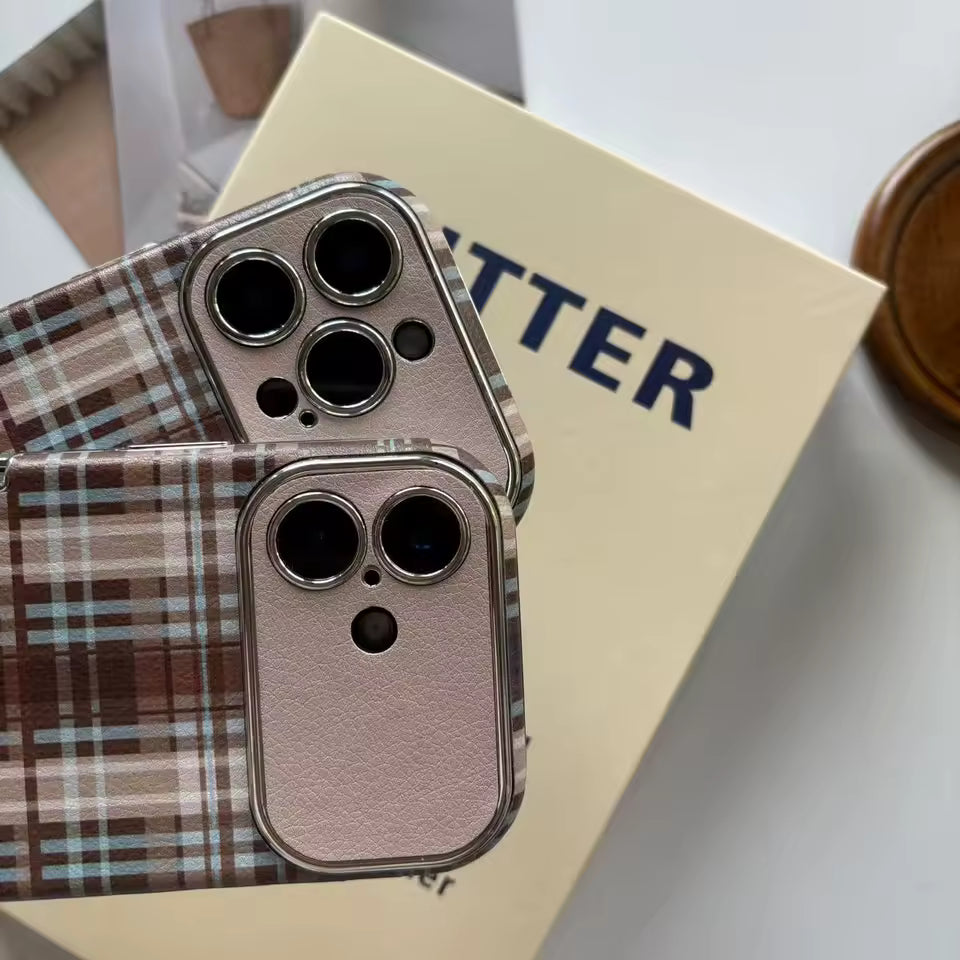 Phone case with plaid pattern on a surface with 'BUTTER' branding.