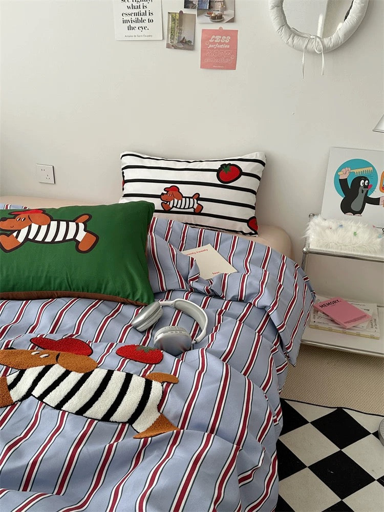Children's bedroom with striped bedding and colorful pillows