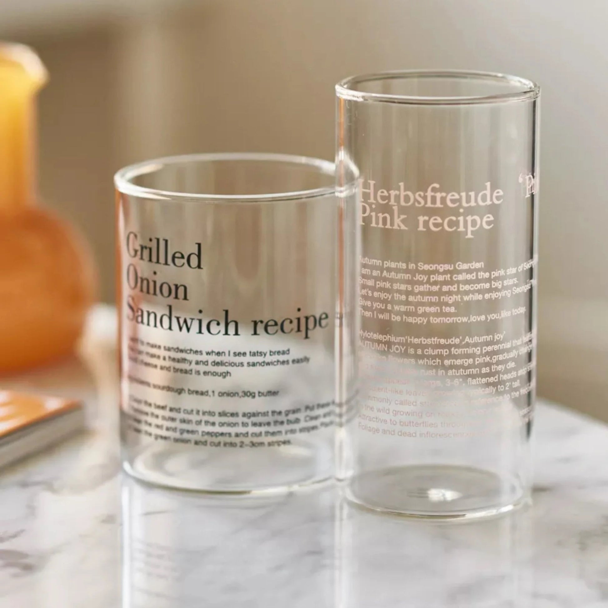 Retro style tumbler glass with elegant French quote design