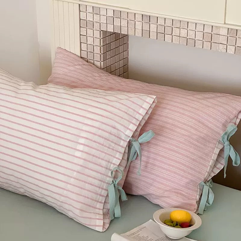Cute striped pillow sham with bows, aesthetic bedroom pillow decor for girls.
