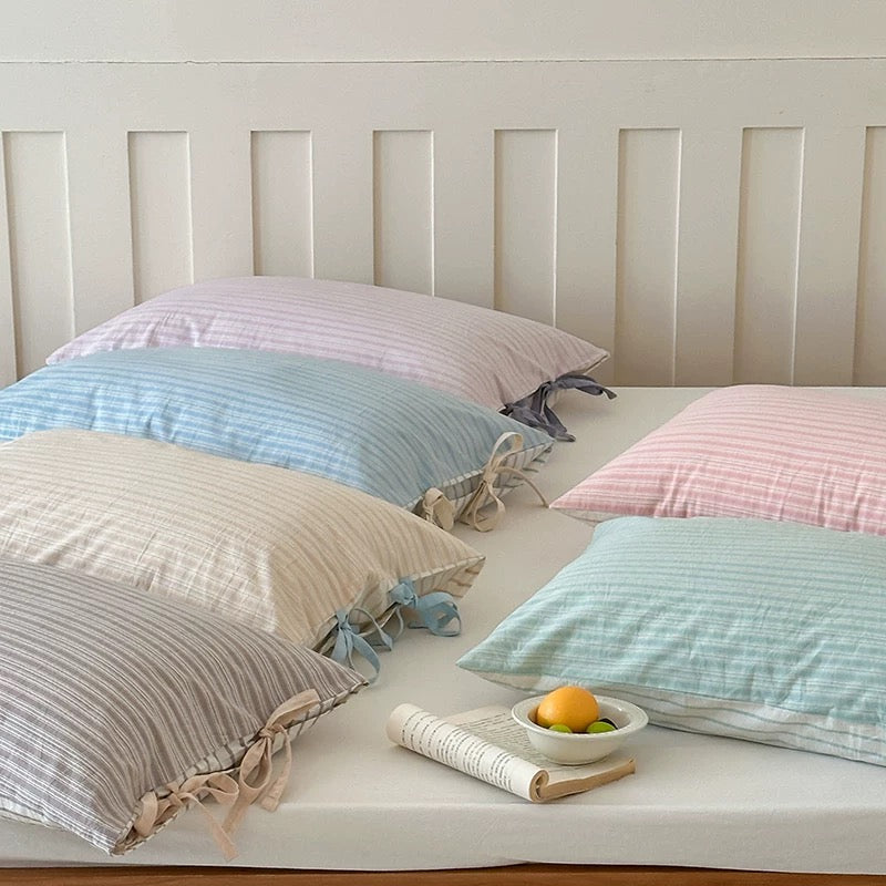 Cozy soft girl pillow cover with pastel stripes, perfect for TikTok bedroom setups.