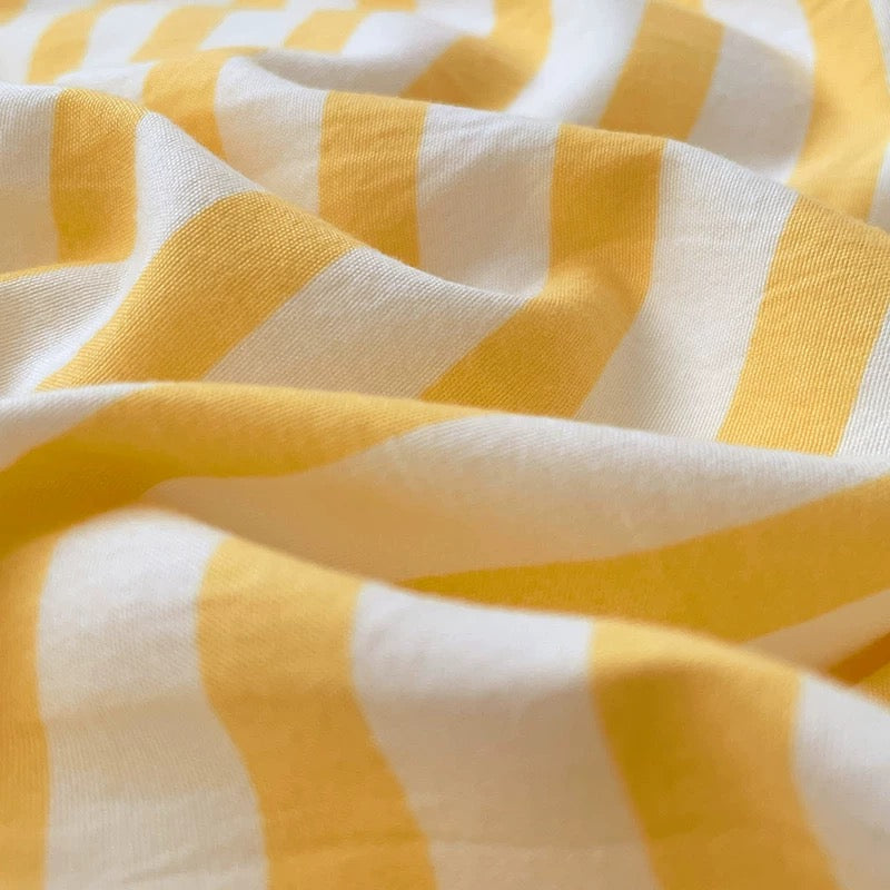 Close-up of yellow and white striped fabric