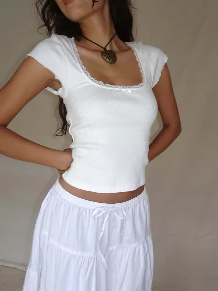 Cottagecore lace trim crop top in white. Square neck Y2K T-shirt with short sleeves for retro 2000s and milkmaid aesthetic.