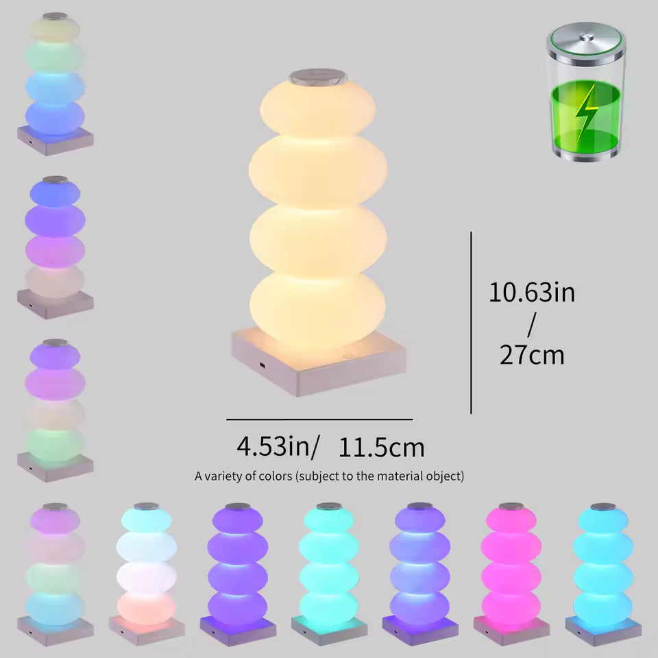 Stacked cylindrical lights with color-changing capabilities and charging icon on a gray background