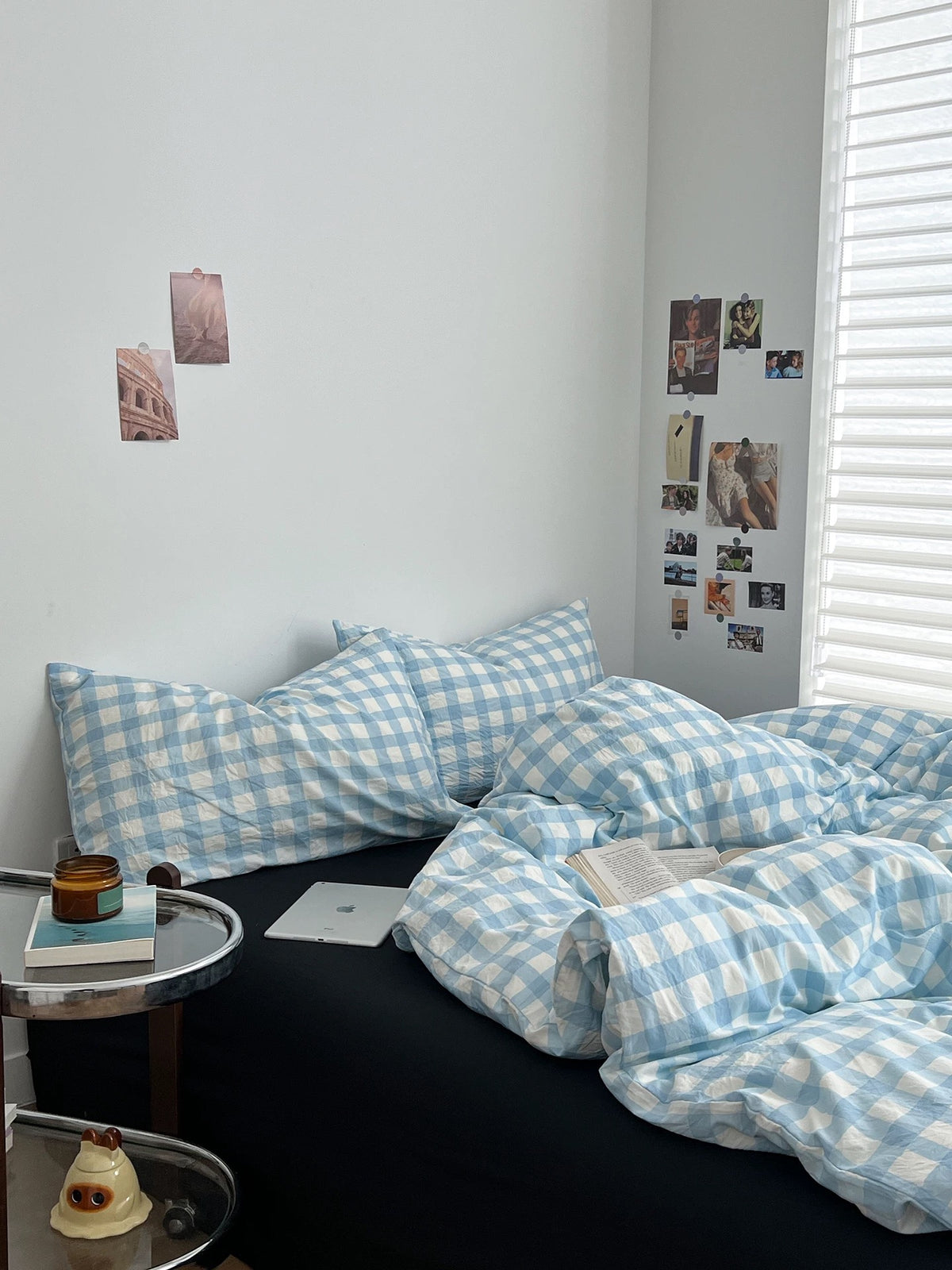 Light blue duvet cover set with gingham checks and black accents in a preppy bedroom