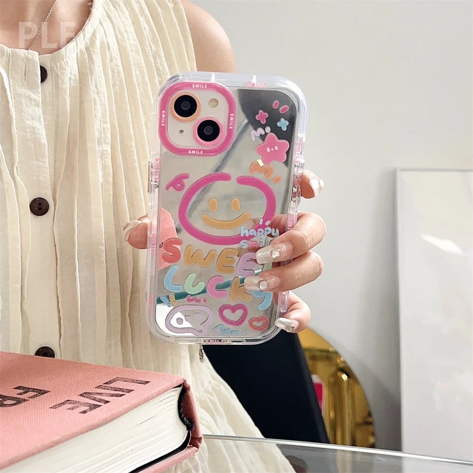 Y2K Lucky Girl iPhone case with heart mirror and smiley face design. Durable back cover for iPhone 14, 15, and Pro Max.