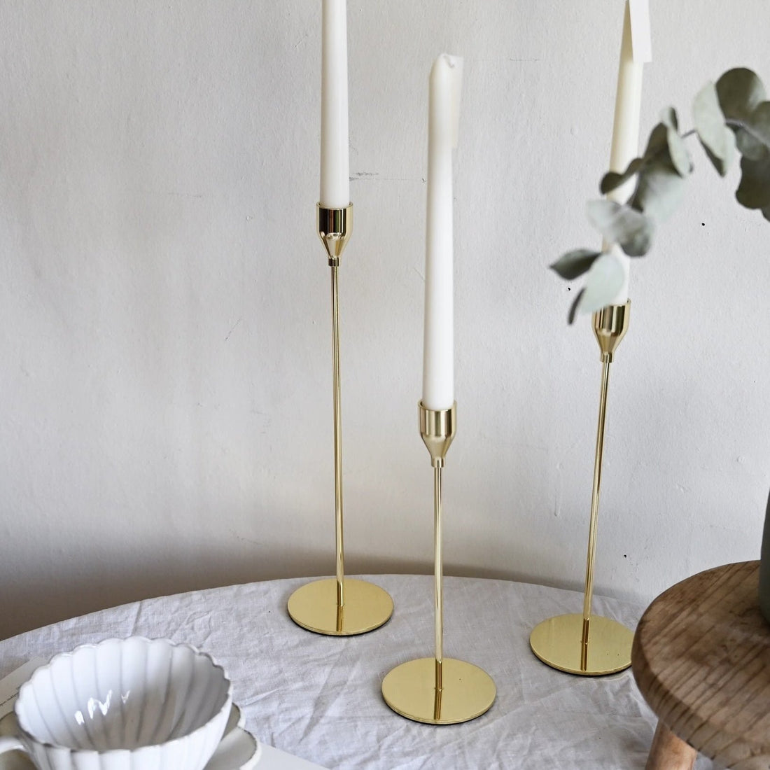 Set of 3 metal candle holders in gold, silver, and black