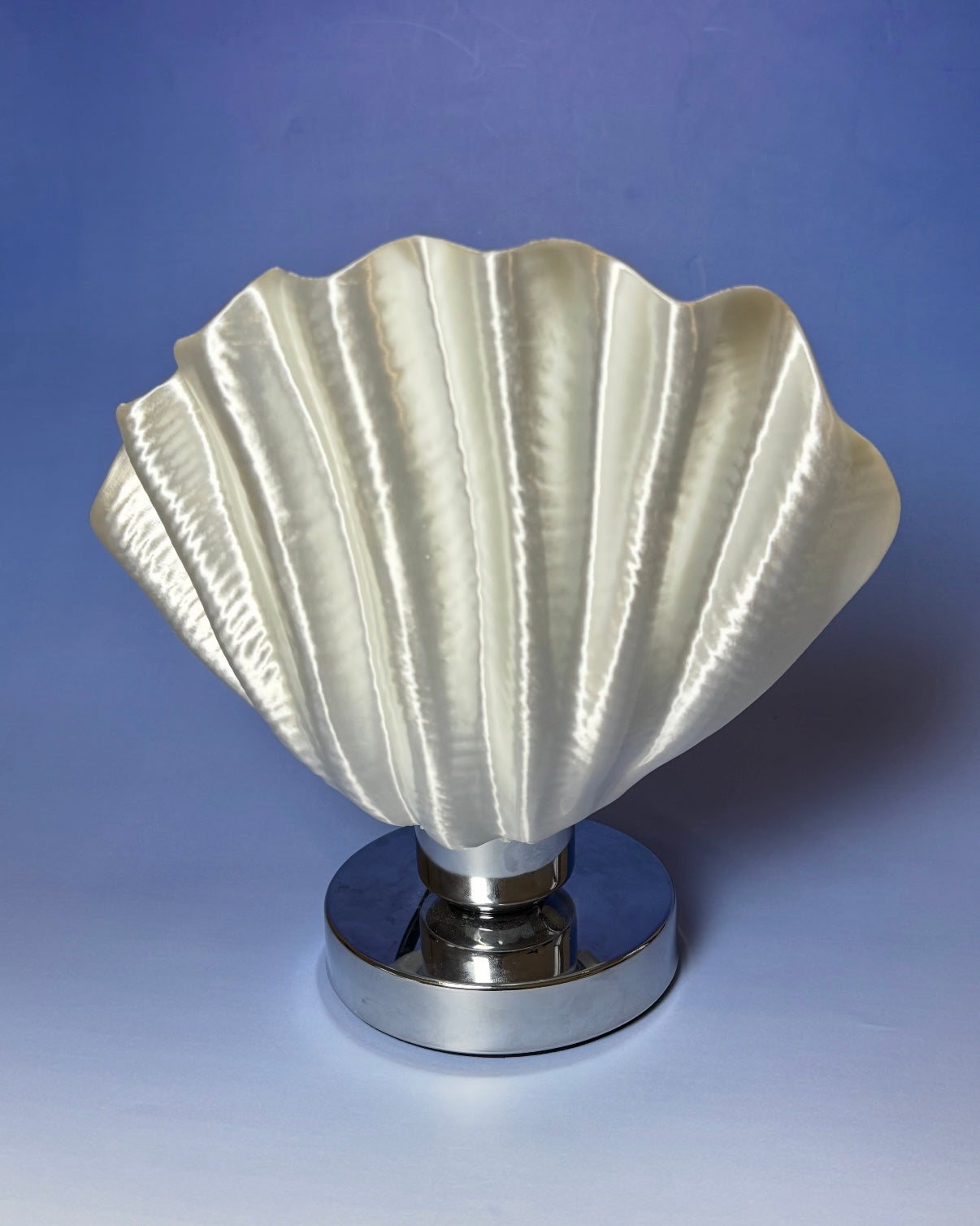 Aesthetic white scallop bedside lamp with textured shell surface and gentle warm illumination