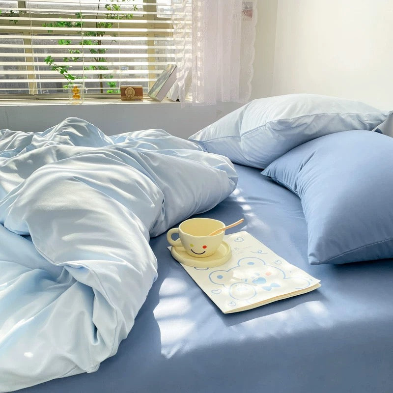 Cozy and aesthetic pastel blue duvet cover set with matching pillows.