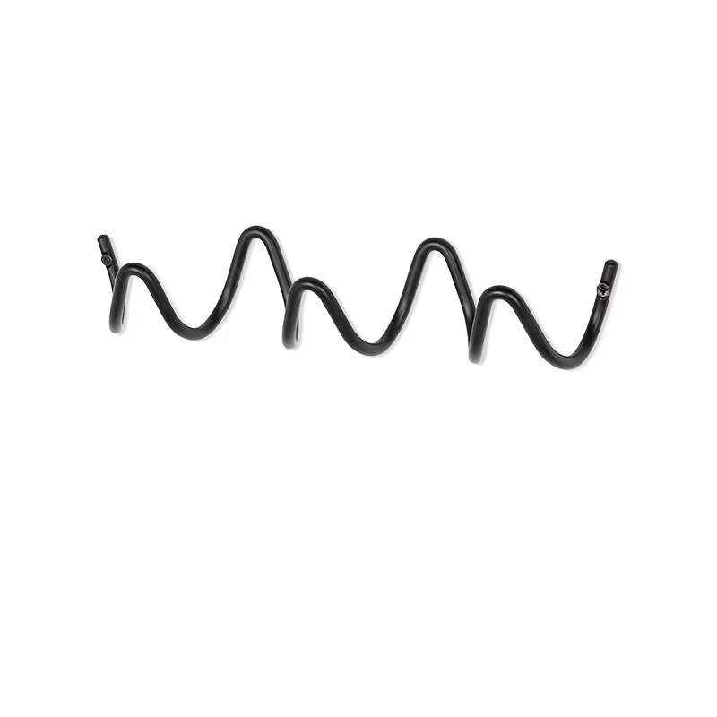 Close-up of black wave-shaped metal hooks designed for hanging bags, caps and accessories.