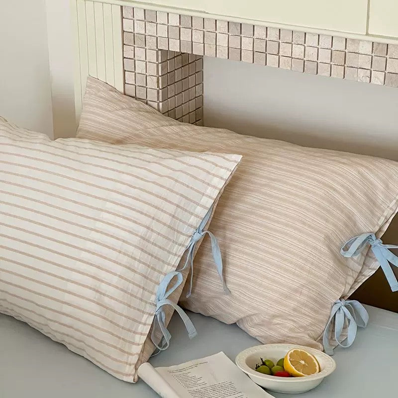 Pastel mint striped pillow cover in soft cotton, Korean-inspired bedroom accessory.