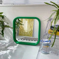 Portable rectangular mirror with metal frame. Aesthetic Nordic bathroom decor piece for bedroom, vanity, or makeup use.