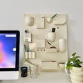 Modern wall-mounted organizer with 16 compartments. Decorative and functional storage for home and office use.