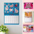 Illustrated cat wall planner with monthly kitty designs