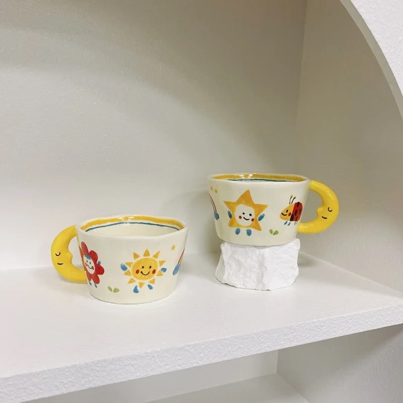 Stylish Korean yellow ceramic mug with creative hand-painted designs. Perfect for coffee, milk, or tea.