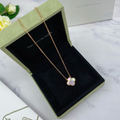 Gold clover necklace with mother of pearl detail