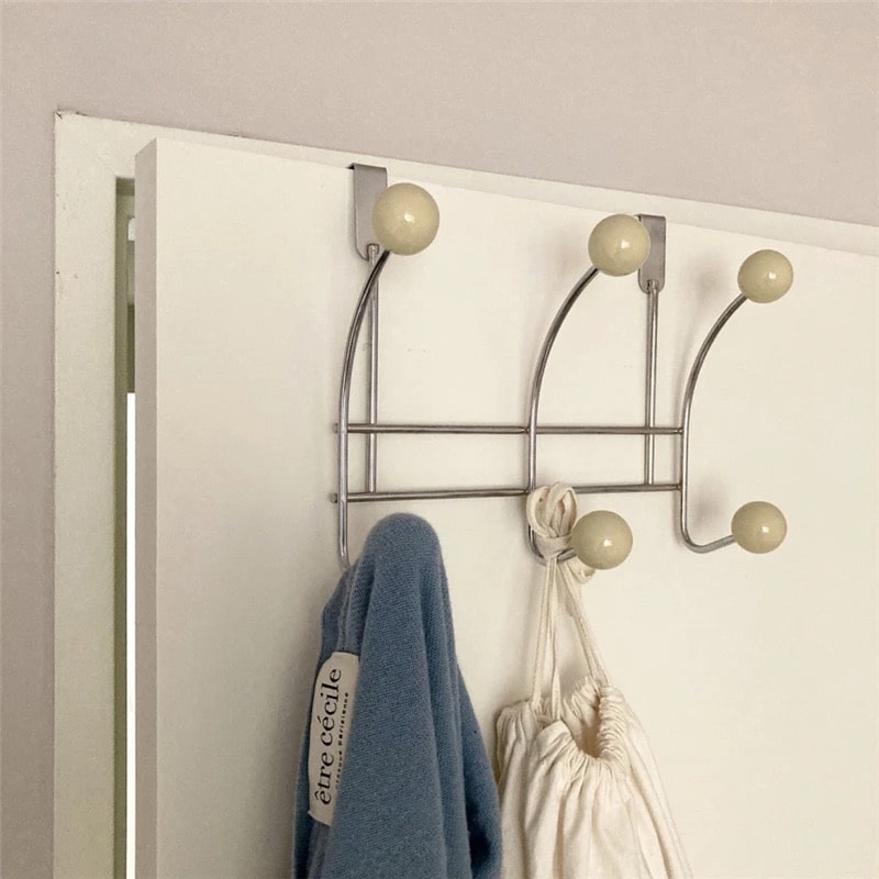 Minimalist wall hanger with hooks for coats, bags, and hats