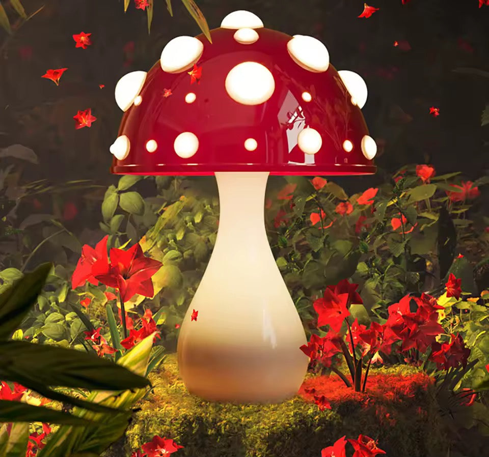 Mushroom-shaped lamp with red cap and white stem in a garden setting with flowers.