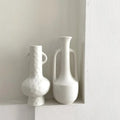 White ceramic vase for flower arrangements and decor