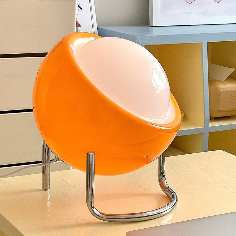 Orange and white chair on a desk with a blurred office background