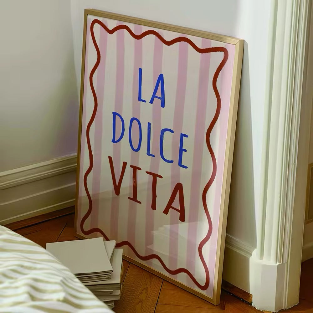 The poster displayed above a minimalist desk setup, adding a touch of Italian charm.